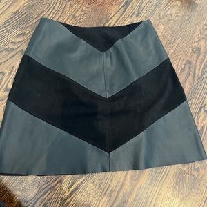 Black suede skirt with faux leather embellishments